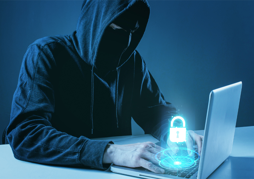 hacker with laptop representative image