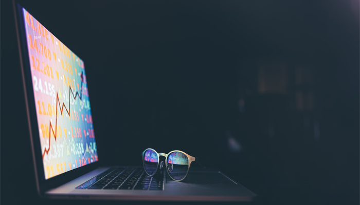 laptop displaying line chart of price