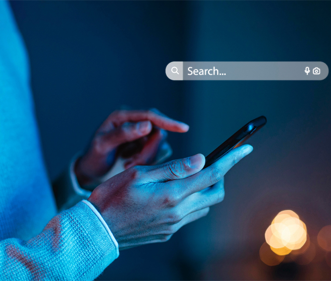 person using smartphone search prompt in background